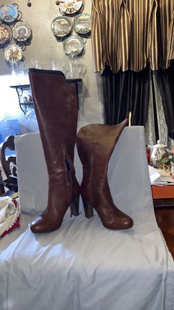 Never worn UGG leather knee high 4” heel with 1/2” platform