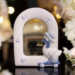 Vintage cute duck photo frame with a music box
