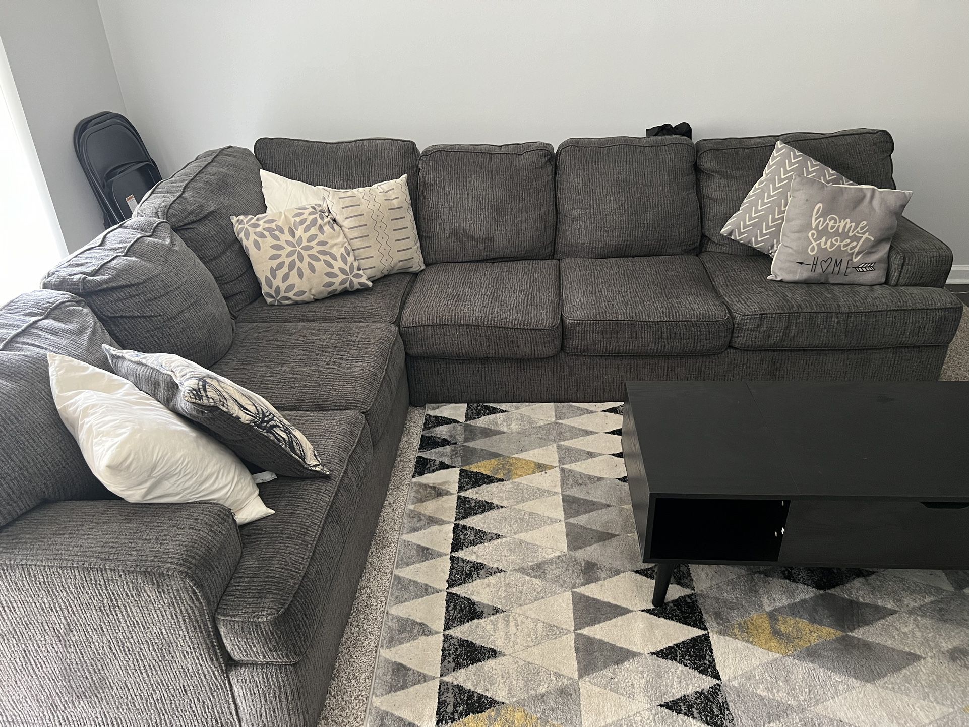 Sectional Couch, Rug,  and Table