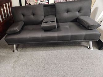 Brand new 72" x  44" black faux leather sofa futon
