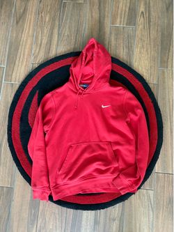 Red Nike hoodie size M with a small hole