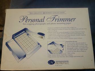 A Personal Trimmer for cropping photographs and mounting paper.