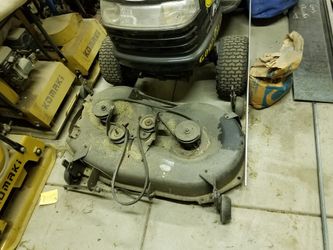 Craft man driving lawn mower attachment