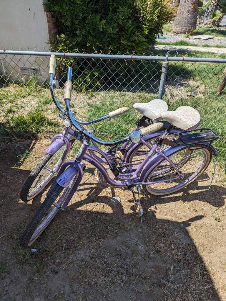 Two Girls Swing Bicycles
