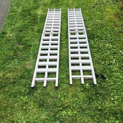 7.1/2 foot long aluminum folding ramps 12 ins wide used 1 time great for dirt bikes and riding mower and golf carts work great 