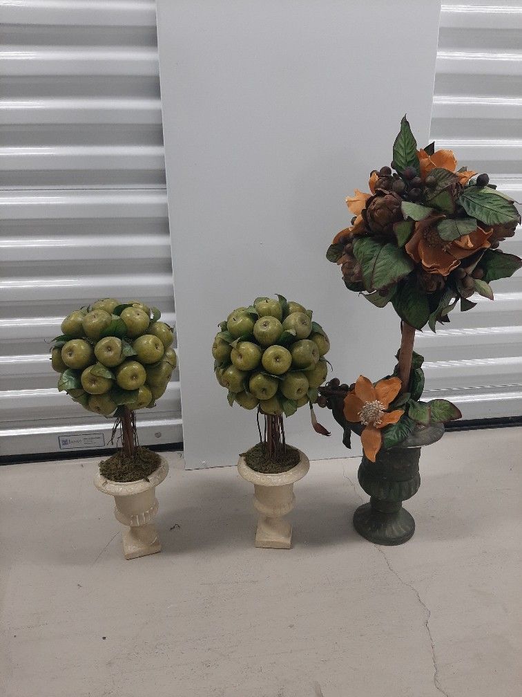 Sell all three.  Green apple topiary tree $16.00 each
Holiday topiary tree in urn vase $28 