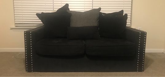 Black love seat with nail head trim