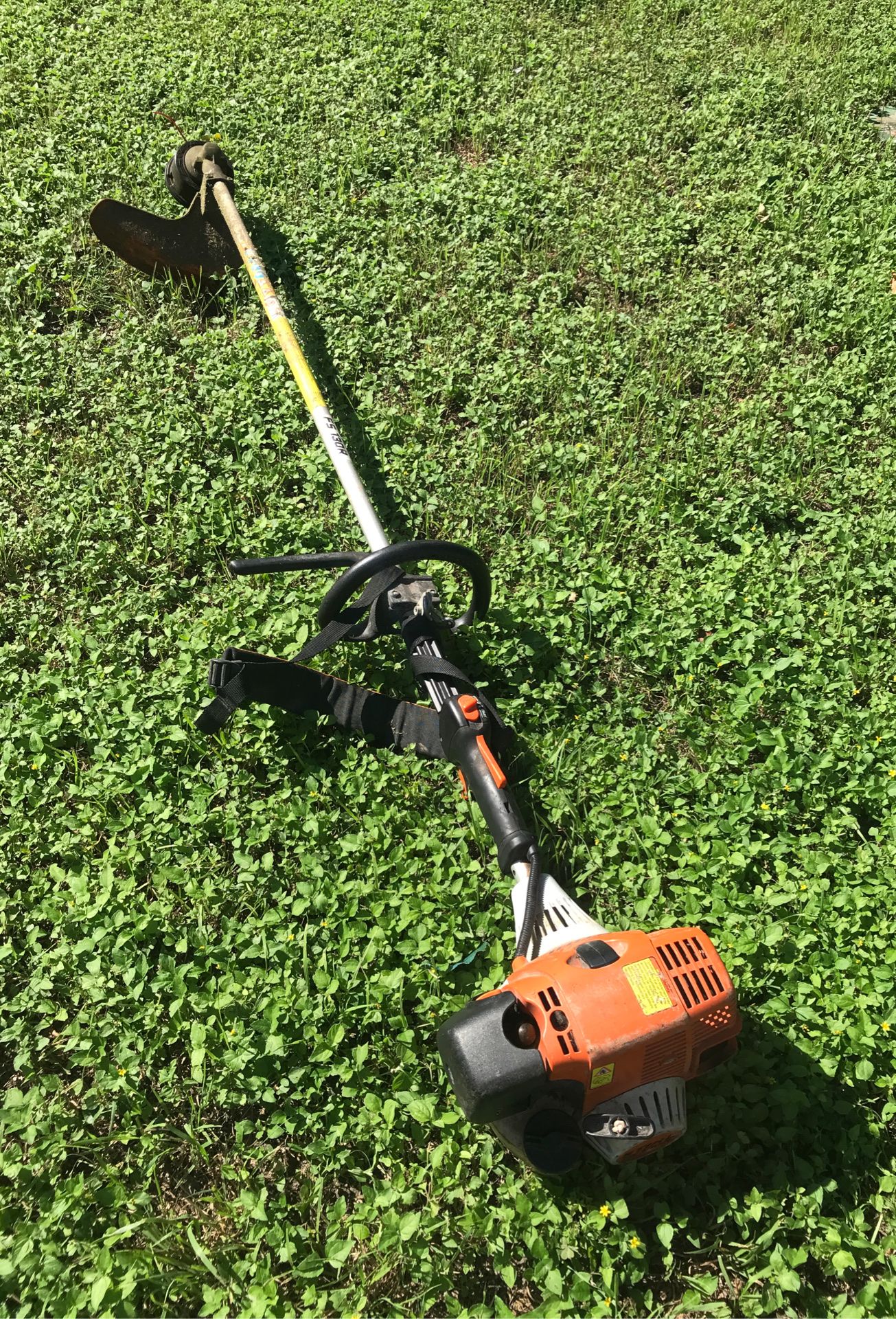 Stihl FS 130R weed trimmer with blade attachments