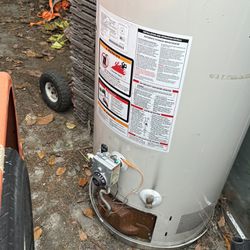 50 Gallon Ge Water Heater And Propane Bbq And Wooden Pallets And Bird Cage And Dog House