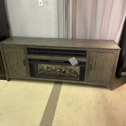 Montillan Grayish Brown 84" TV Stand w/ Electric Fireplace Insert

