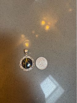 blackjack, turquoise, and silver pendant