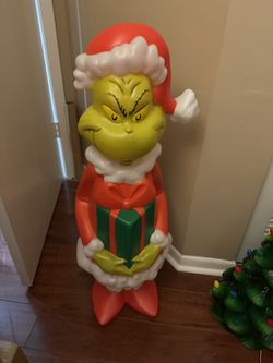 The Grinch Blow Mold Holding A Present