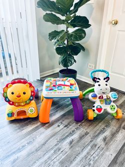 Walkers( 2psc) and musical table! All tree items $50. Complete like brand new.