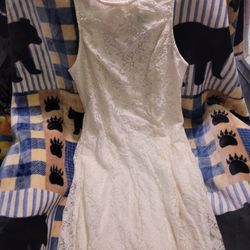 Speechless white lace dress with bow in back and pockets. Size L