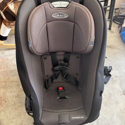 Reliable Graco Contender Slim car seat. Has gray and black color.