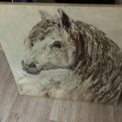 Canvase picture of a horse. It’s really beautiful I just moved and have no space for it. And the small rode iron side table. Very study. Like new