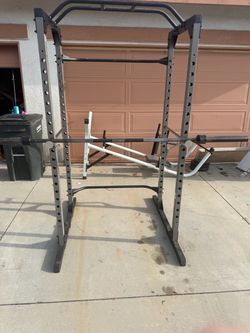 Very nice and strong squat rack with 7 ft Olympic bar. Perfect for squats, bench press, and pull ups. $300