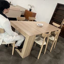 Extendable dining table with six matching chairs