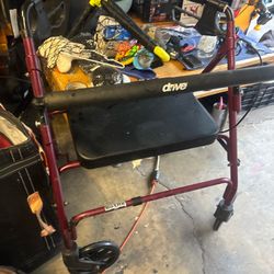 Burgundy drive Walker, with four wheels and an extra large seat