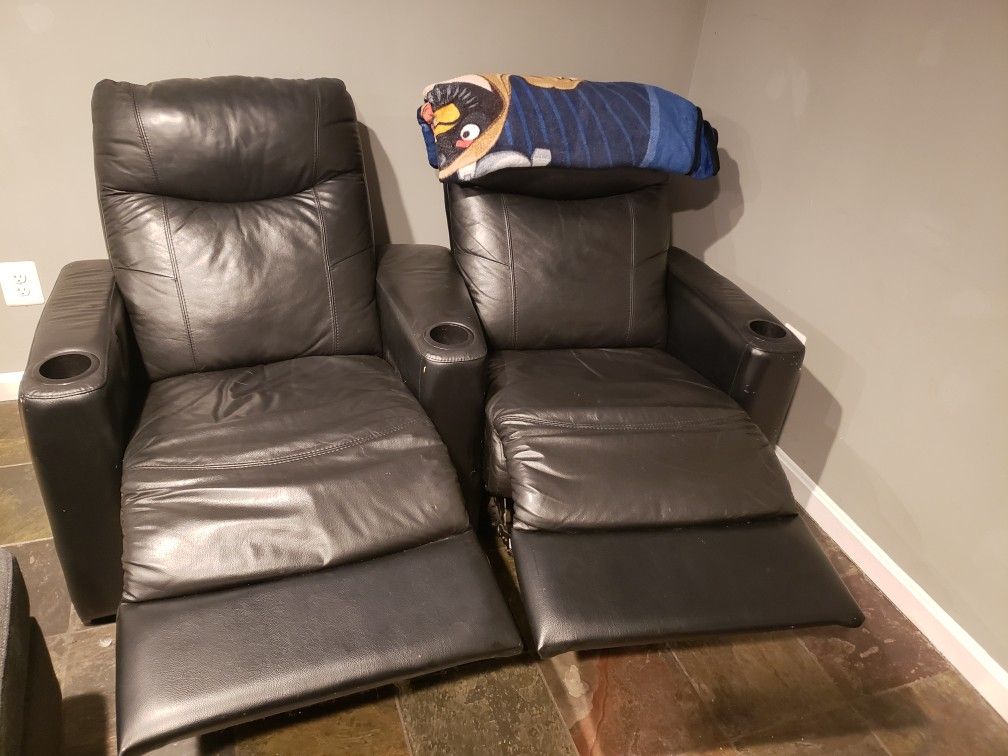 Twin black leather chairs