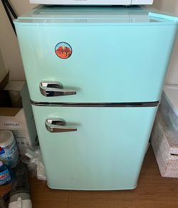 n Insignia Retro 3.1 cu. ft. mini fridge with a separate top freezer