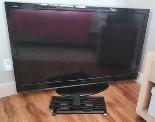 Sharp Aquos 60" LCD TV (LC-60E69U) HDTV with stand, remote, and wall mounting hardware