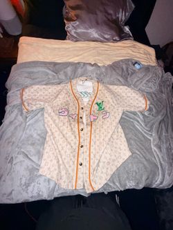 LV Monogram baseball jersey and LV Mink fur coat.