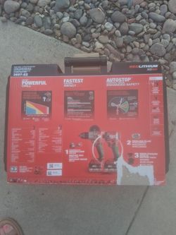 Milwaukee drill and impact drill with batties and charger in case