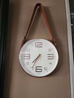 Wall clock with the strap I guess LOL