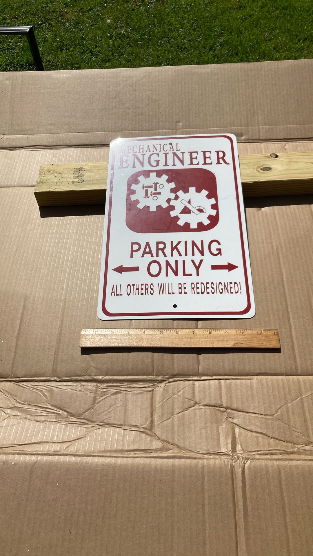 All metal, mechanical engineer parking only sign