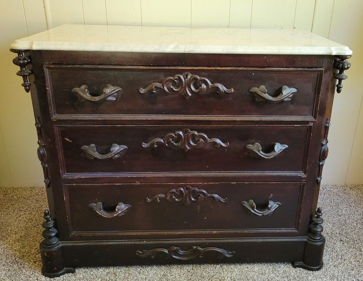 Circa 1860's Victorian Mitchell and Rammelsberg 3 drawer marble top dresser.