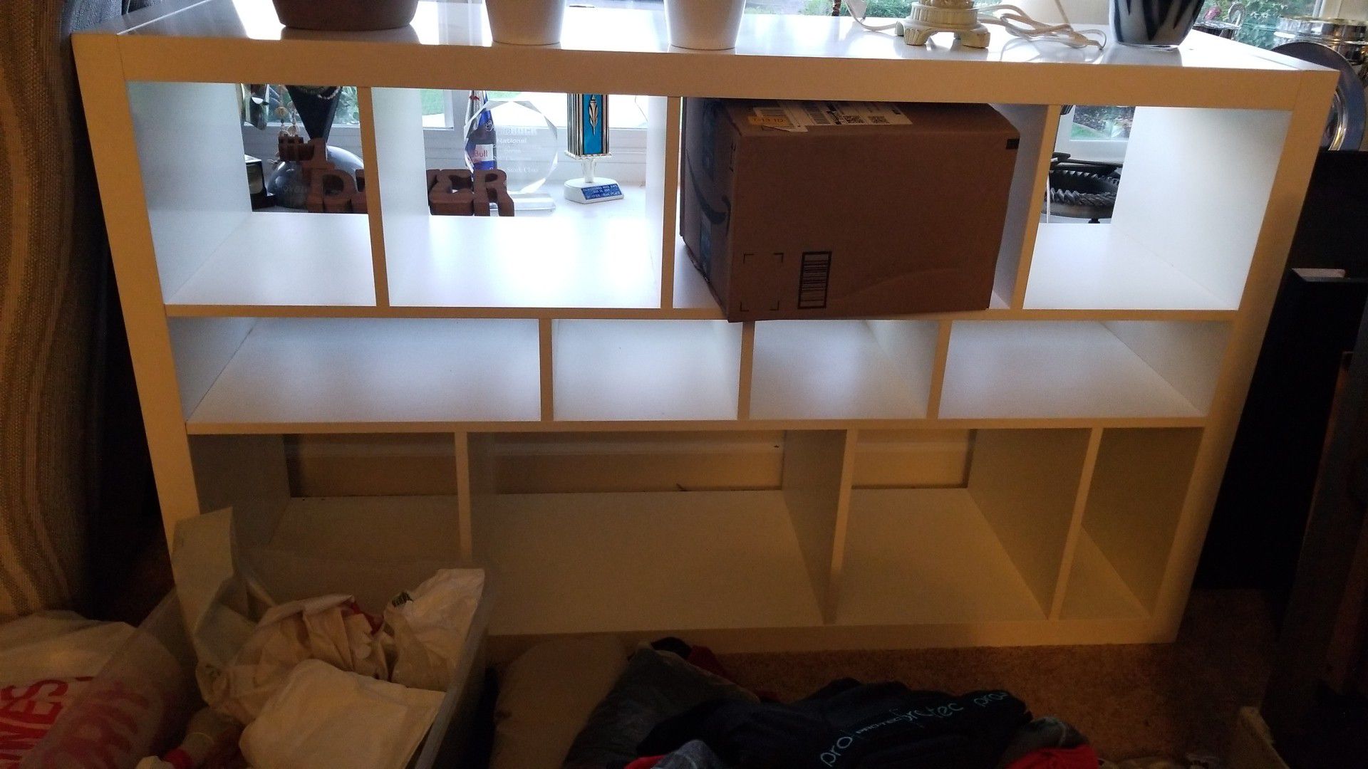 White shelving unit. Bookcase display shelf