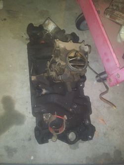 Stock 2 barrel carb and intake. Chevy 350