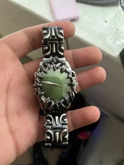 Silver fire watch with green face