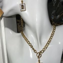 Beautiful stainless steel set.  chain, bracelet and earrings