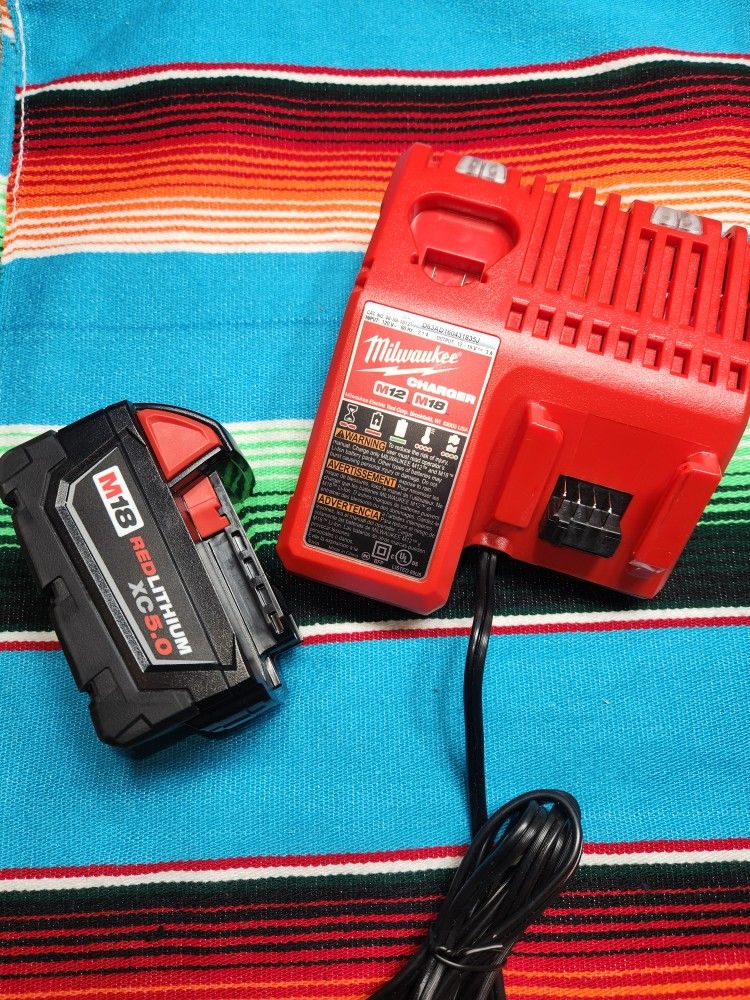 Milwaukee M18 5ah Battery & M12/M18 Charger...NEW_NUEVO $100 PRECIO FIJO_FIRM PRICE