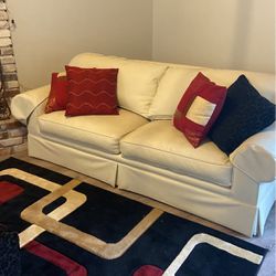 White Couch with Pillows and coordinating Pillows and Rug