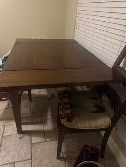 Wooden dining room/kitchen table with chairs
