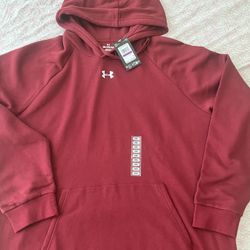 Under Armour men's red pullover hoodie with a soft, comfortable feel. Features a front kangaroo pocket and classic UA logo for a sporty look. Lightwei