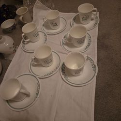  Rosemarie features a floral design with pink tulips and green leaves, often with a green band around the rim. 