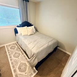 A Queen Bed With A Mattress 