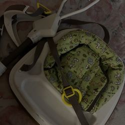 Baby jumper hangs from door 