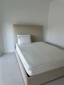 Queen bed with its mattress.