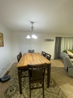 Wood dining table and 6 leather chairs