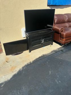 Couch with tv and stand