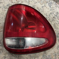 2004-2007 DODGE Caravan LEFT Rear Tail Light 19-04A-PM OEM (A7-25)  Part of the red is chipped off at the bottom….very unnoticeable as this pa