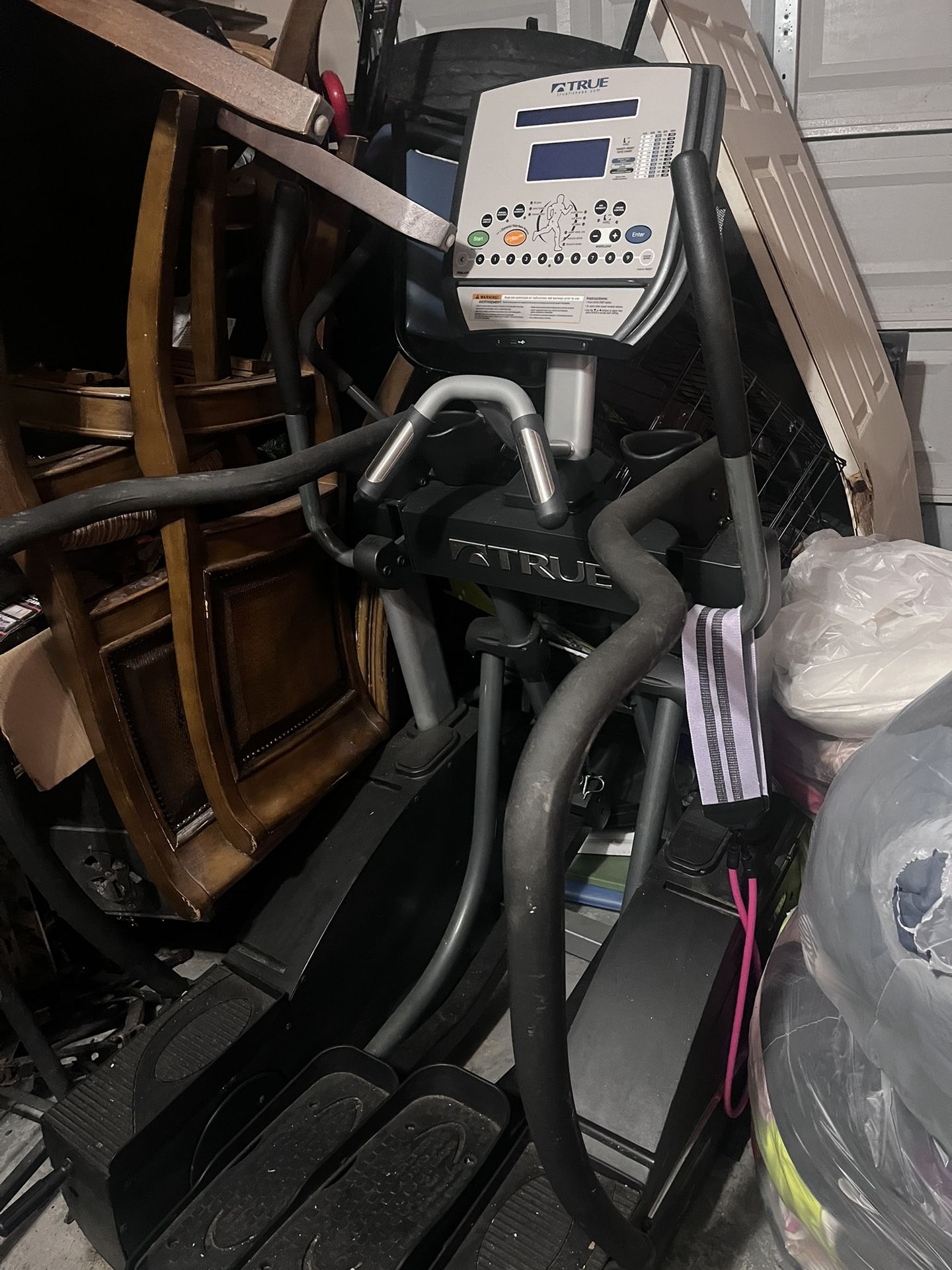 TRUE Elliptical workout machine, Color Grey.