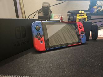 Nintendo Switch console with red blue Joy-Cons