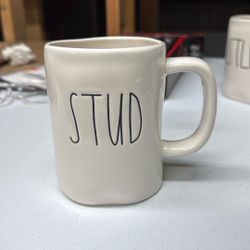 Rae Dunn stoneware mug from the Artisan Collection by Magenta, specifically featuring the word "STUD" in her signature 
