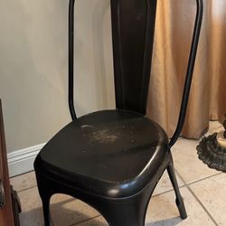 Tolix-style industrial metal dining chair (often called a “Marais” chair).